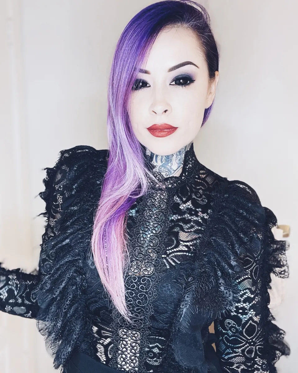 Cybil Souza in black lace with violet hair